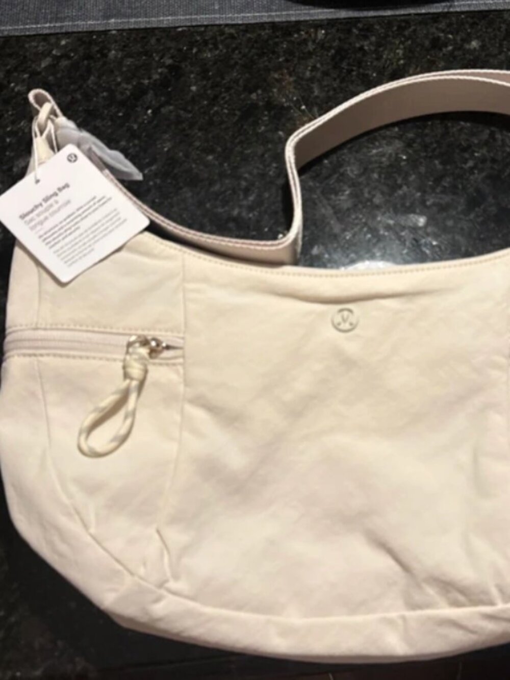 NWT Lululemon Slouchy Sling Bag. 6L Light Ivory with Gold hardware. LU9CACS.